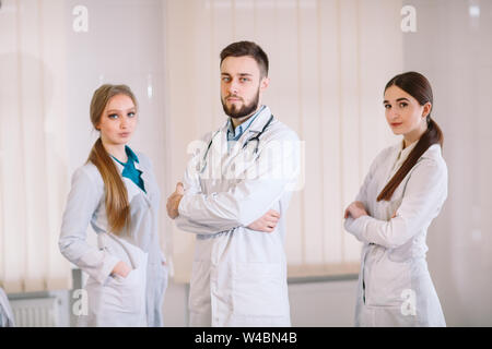 Portrait of doctors in white coats in the hospital ward Stock Photo