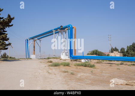 Blue oil turbines. They have laid the groundwork for passing through the oil pipeline .industrial pipelines on pipe-bridge Stock Photo