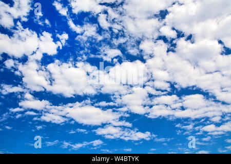 Summer day and the white clouds that travel blue sky. Stock Photo