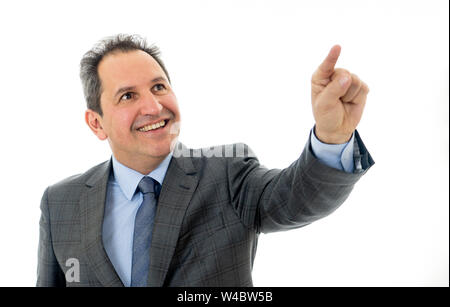 Studio portrait of Mature business man pointing as using a virtual desktop or screen. Smiling feeling confident and successful. People business educat Stock Photo