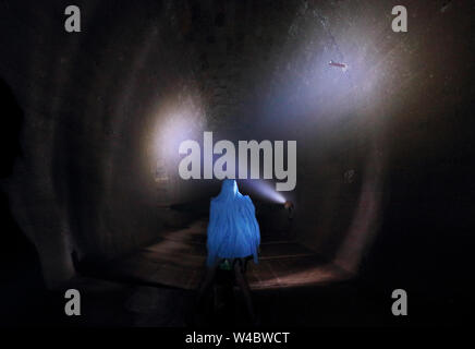 Man  alone in dark tunnel, Horror Stock Photo