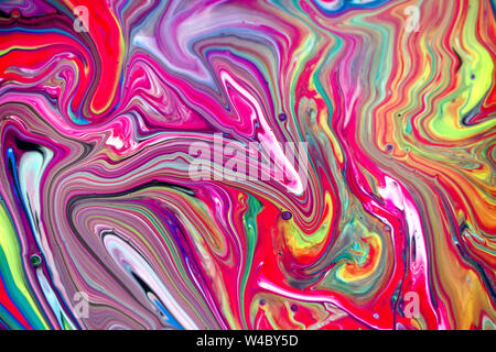 Abstract multi-colored paint background. Acrylic texture with marble pattern. Wallpaper. Mixing paints. Modern art. Stock Photo