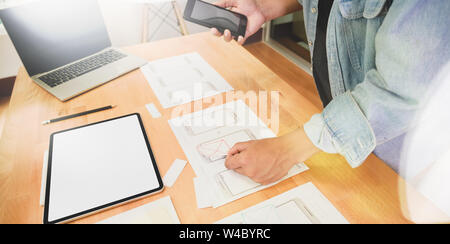 UI UX graphic designer sketching and planning application Stock Photo