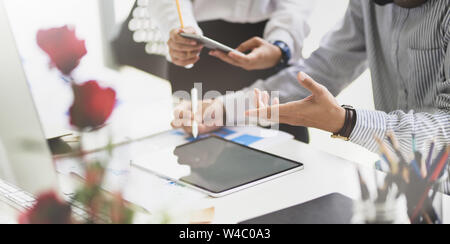 UI UX website development team sketching wireframe layout for responsive web content in studio Stock Photo