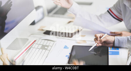 UI UX website development team sketching wireframe layout for responsive web content in studio Stock Photo