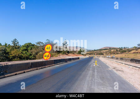 Road Highway industrial construction expansion of new traffic routes lanes entry exit ramps to existing network. Stock Photo