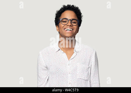 Happy african American female laughing at joke in studio Stock Photo