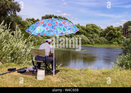 Fishing umbrella at river or lake beach Stock Photo - Alamy