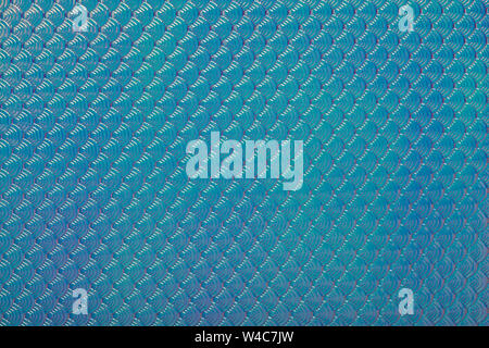 Holographic mermaid fish scales iridescent faux leather texture abstract background. Stock Photo