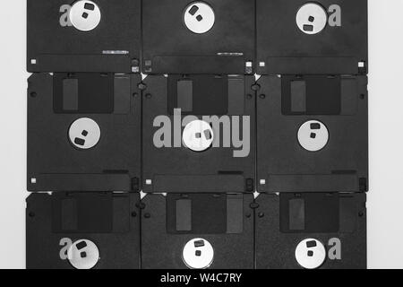 Background of bunch black floppy disks on white background Stock Photo