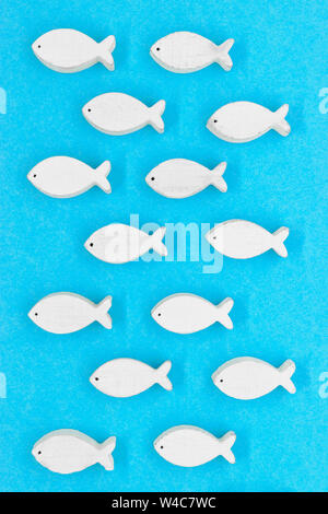 Abstract background of very old white and grunge white fishes on soft blue matte background Stock Photo