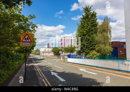 A view down Richard Street in the Aston area of Birmingham leads to an industrial estate with three gasholders, Birmingham, UK Stock Photo