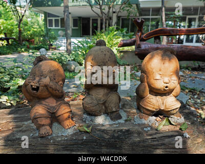 Closeup Three Wise Monkeys Statue in Children Form, Is a Symbol of 'See No Evil, Hear No Evil, Speak No Evil' Stock Photo