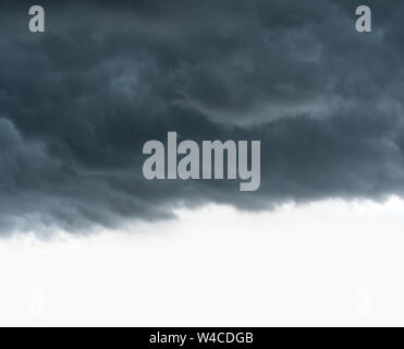Thunderstorm clouds covering a clear sky. Stock Photo