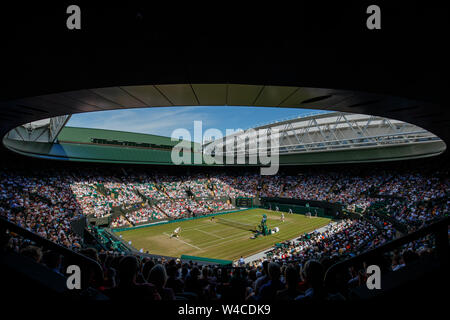 General View of Court 1 with Roger Federer of Switzerland and Jay Clark of GB in action at The Wimbledon Championships 2019. Held at The All England L Stock Photo