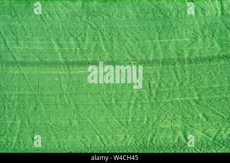Texture of green shantung silk fabric closeup as textile background Stock Photo