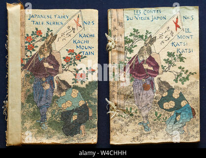 Covers of old Japanese fairy tale books printed by Hasegawa on traditional textured crepe washi paper (chirimen-gami) translated into English & French. Stock Photo