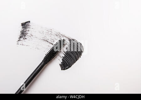 Black mascara cosmetics stroke isolated on white background close-up Stock Photo