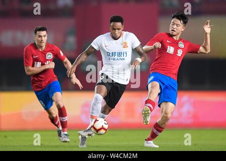 Brazilian football player Rafael Pereira da Silva, commonly known as Rafael or Rafael da Silva, middle, of Wuhan Zall F.C. keeps the ball during the 19th round of Chinese Football Association Super League (CSL) against Henan Jianye in Zhengzhou, central China’s Henan province on 21 July 2019. The match ened with a draw 0-0. Stock Photo