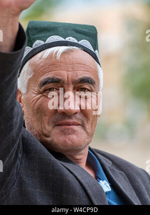 Portrait of a Uzbek Man wearing traditional tubeteika hat, Bukhara, Uzbekistan Stock Photo
