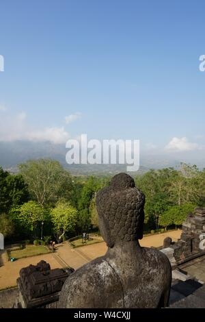 Buddha statue and beautiful view from Borobudur Temple in Central Java, Indonesia. Stock Photo