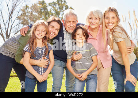 Happy extended family with children and grandparents as a symbol of ...
