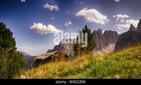 barn and meadow in Alta Badia, Alps Italy Stock Photo