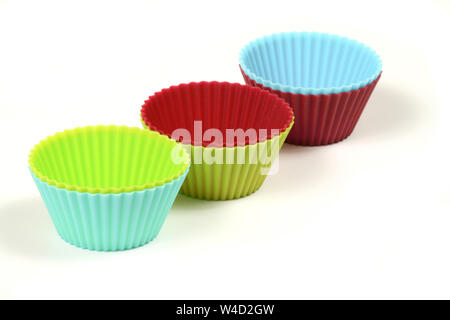 Cupcake cups in various colors isolated over white Stock Photo