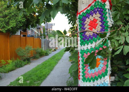 Yarn Bombing in a Green Alley, Knitted Decoration, Montreal Stock Photo