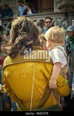 mother holding her baby over shoulder Stock Photo