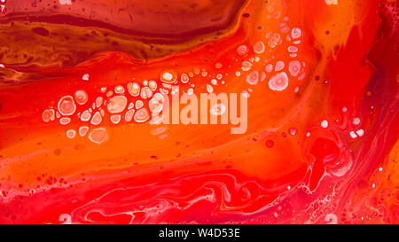White dots, stains and curles on coral red, abstract background Stock Photo