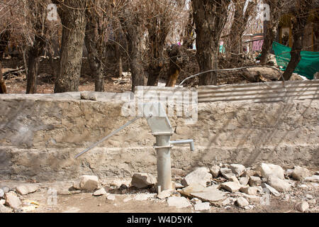 Antique groundwater well manual lever pump at outdoor in alley of Ladakh village at Himalayan valley in Jammu and Kashmir, India while winter season Stock Photo