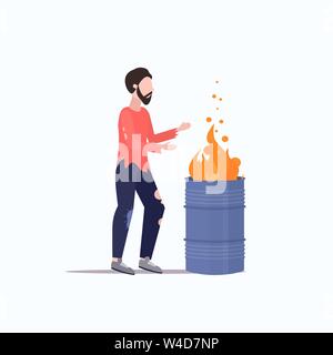 poor man warming by fire beggar guy standing near burning garbage in barrel homeless jobless concept flat full length Stock Vector