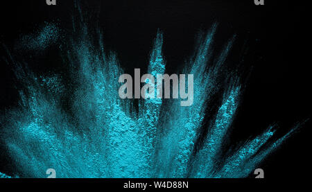 Freeze motion of blue powder throwing on black background Stock Photo