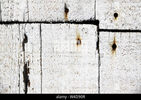 White wooden rustic planks attached with rusty nails Stock Photo