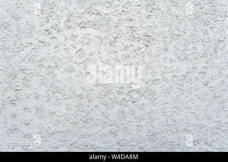 texture of the paint is white. Wall background with plaster . Stock Photo