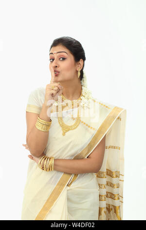 Portrait of a south Indian woman with a finger on lips Stock Photo - Alamy