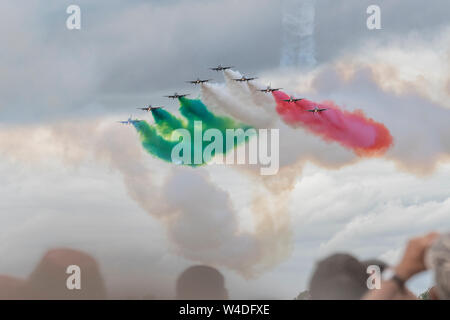 The Italian Air Force provided the highlight for many in the close formations, solo exhibitions and smoke-flag streaming of the ten Aermacchi AT-339A at RAF Fairford, Gloucestershire, UK. 21st July 2019. Stock Photo