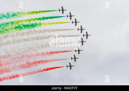 The Italian Air Force provided the highlight for many in the close formations, solo exhibitions and smoke-flag streaming of the ten Aermacchi AT-339A at RAF Fairford, Gloucestershire, UK. 21st July 2019. Stock Photo