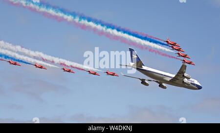 British Airways Boeing 747 and the Red Arrows performing a special flypast at the Royal International Air Tattoo celebrating British Airways centenary Stock Photo