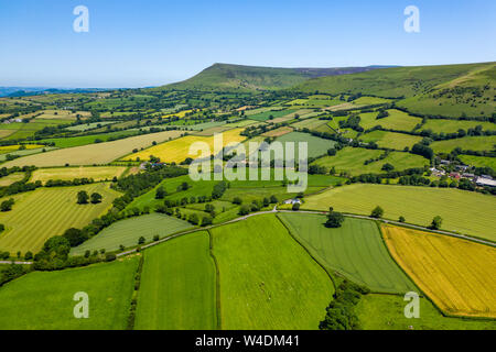 Aerial view of green fields and farmlands in rural Wales