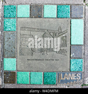 A location guide set in the pavement in St John's Alley for the Maddermarket Theatre in Norwich, Norfolk, England, United Kingdom, Europe. Stock Photo