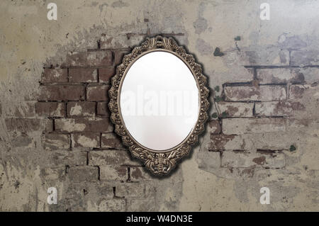 Vintage antique mirror on old brick wall background texture Stock Photo