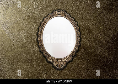antique mirror on gold wall background texture, vintage design Stock Photo