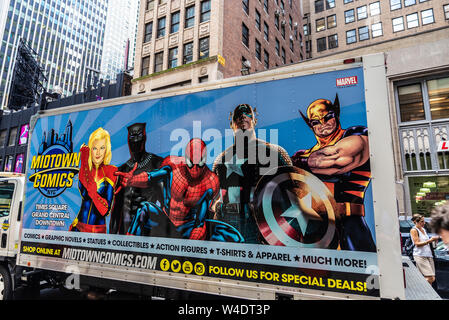 New York City, USA - August 2, 2018: Poster advertising of the Midtown Comics Times Square store with people around in Manhattan, New York City, USA Stock Photo