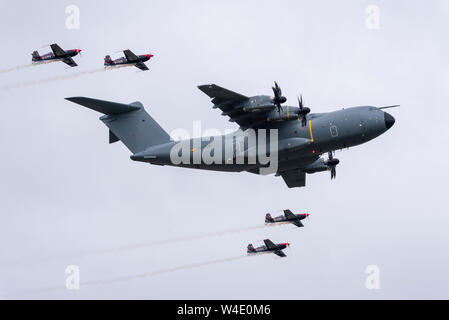 Airbus A400M Atlas with The Blades display team flying at Royal International Air Tattoo airshow, RAF Fairford, UK. Unique formation Stock Photo