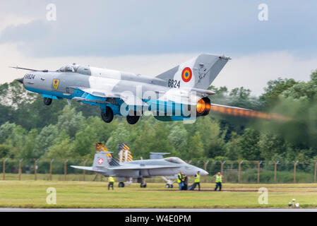 Romanian Air Force MiG-21 LanceR C jet fighter plane flying at Royal International Air Tattoo airshow, RAF Fairford, UK. Vintage Russian Stock Photo