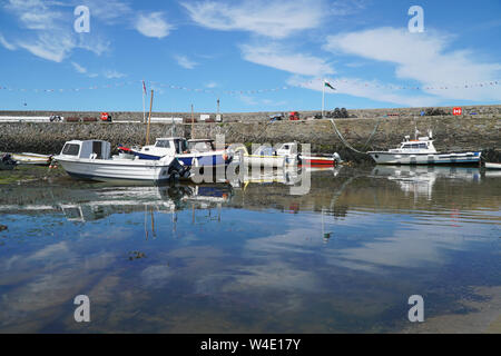 Small boats in the harbour at Cemaes Bay, Anglesey, North Wales, UK Stock Photo