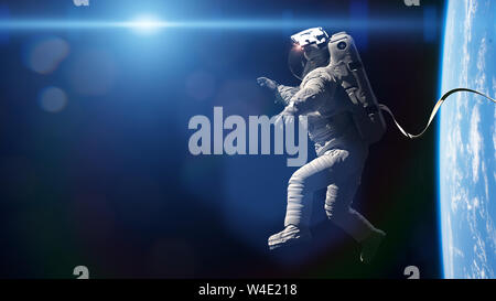 astronaut performing a spacewalk in orbit of planet Earth Stock Photo