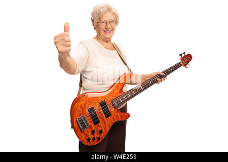 Happy senior woman with an electric guitar showing thumbs up isolated on white background Stock Photo